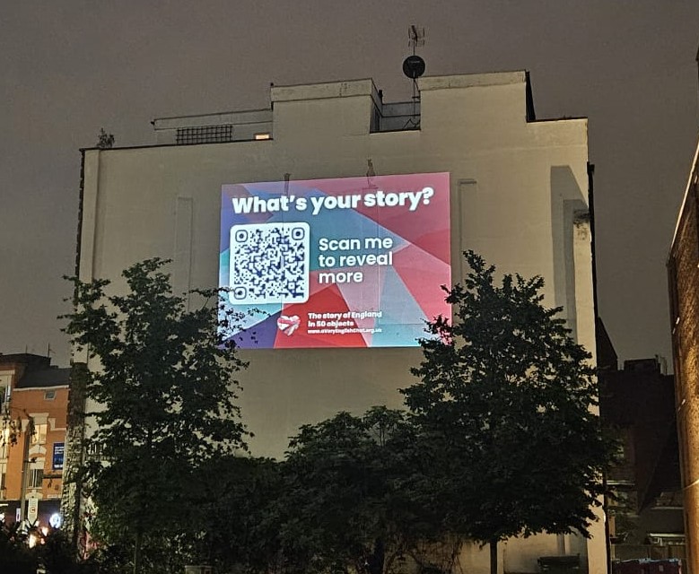 Prjecvtion on the side of Toynbee Hall of the Story of England in 50 Objects campaign